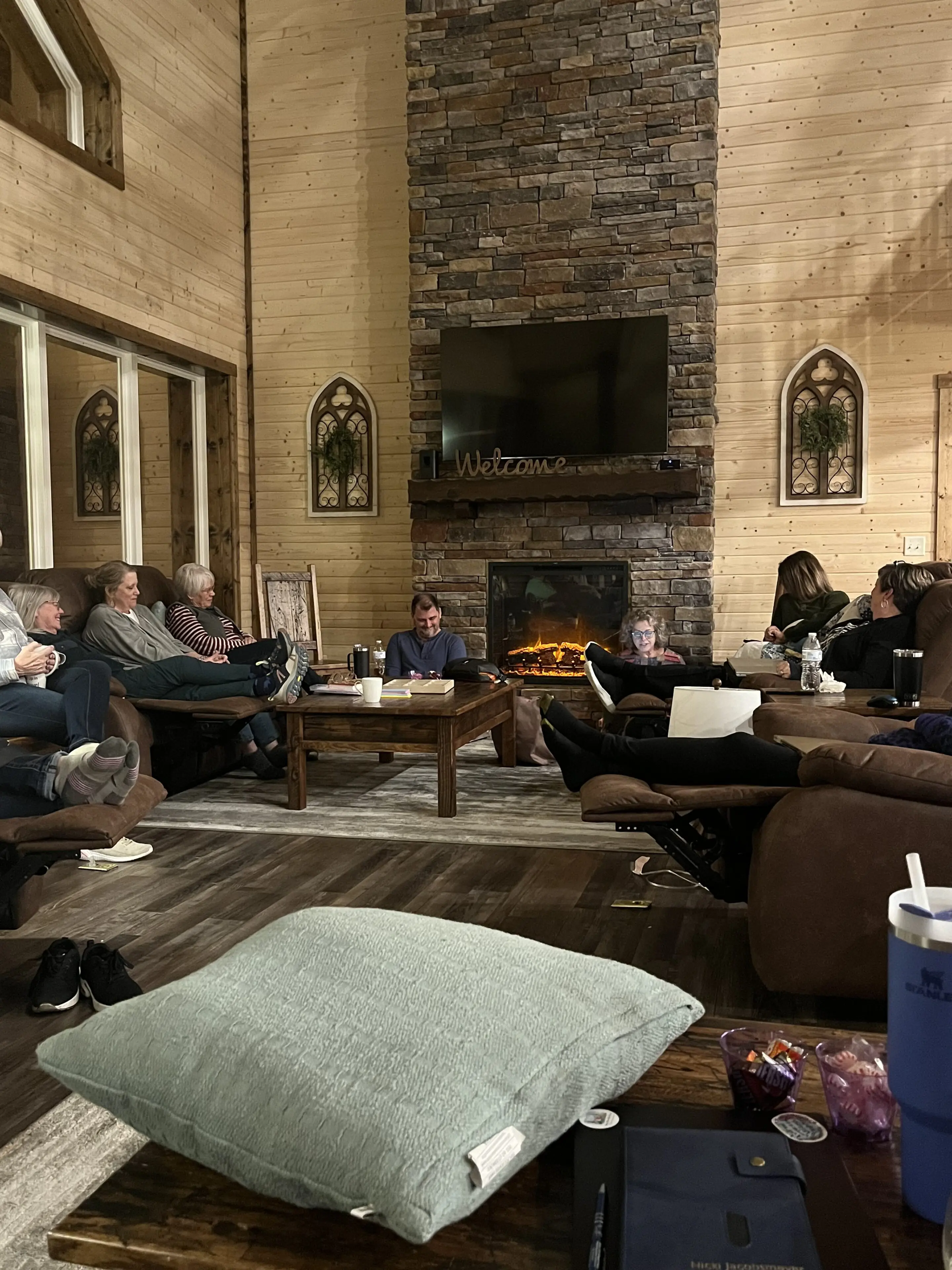 A group of people sitting around in a room.